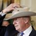 trump-cowboy-hat-usa-jobs-photocredit-voanews-com