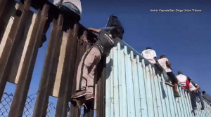 Screenshot - 11_14_2018 , 7_22_19 PM migrant caravan us border fence fox 5 san diego