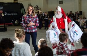 US First Lady Melania Trump attends with Father Christmas personificator a Toys for Tots event at Joint Base Anacostia-Bolling in Washington, DC, on December 11, 2018. - Toys for Tots is a program run by the United States Marine Corps Reserve which distributes toys to children whose parents cannot afford to buy them gifts for Christmas. (Photo by NICHOLAS KAMM / AFP) (Photo credit should read NICHOLAS KAMM/AFP/Getty Images)