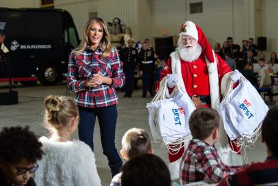 US First Lady Melania Trump attends with Father Christmas personificator a Toys for Tots event at Joint Base Anacostia-Bolling in Washington, DC, on December 11, 2018. - Toys for Tots is a program run by the United States Marine Corps Reserve which distributes toys to children whose parents cannot afford to buy them gifts for Christmas. (Photo by NICHOLAS KAMM / AFP) (Photo credit should read NICHOLAS KAMM/AFP/Getty Images)