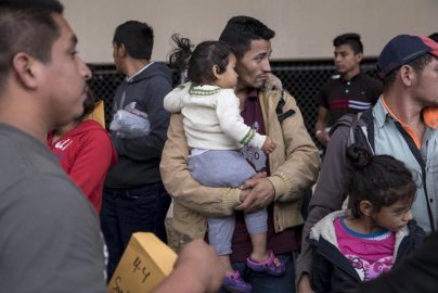 migrant-men-kids-bostonglobe-com