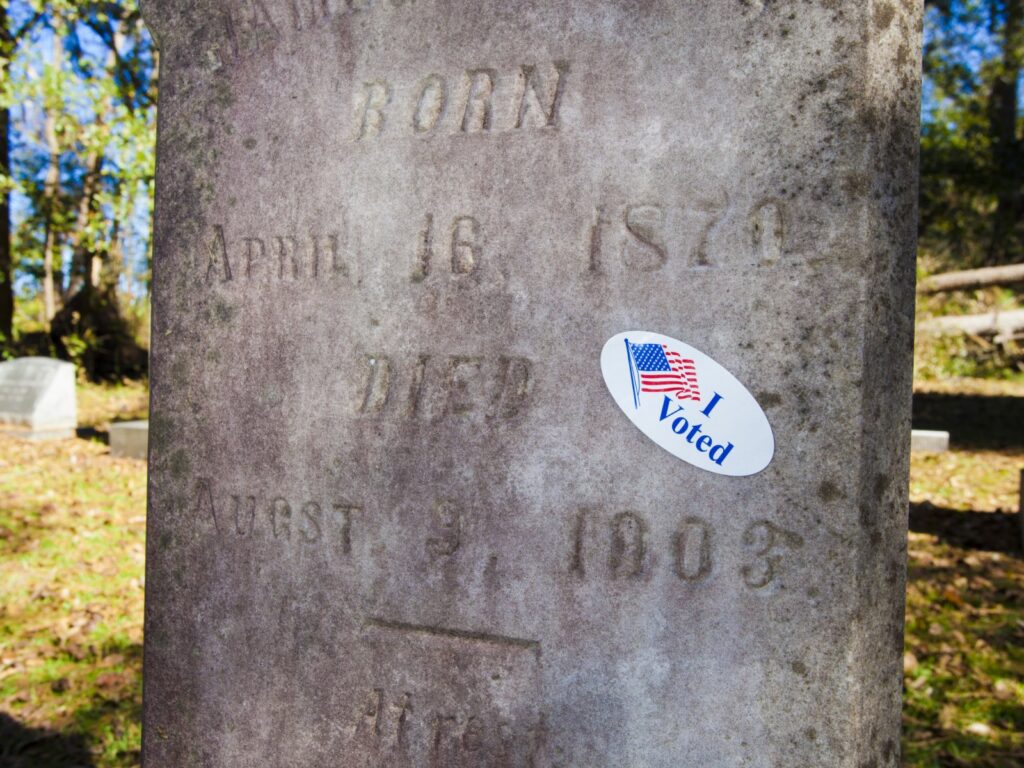 dead-people-voting-election-cemetary-headstone-i-voted-newsweek-com-2021-truth