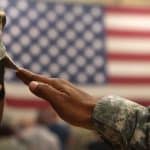 soldier-saluts-us-american-flag-military-cheatsheet-com-2021-truth