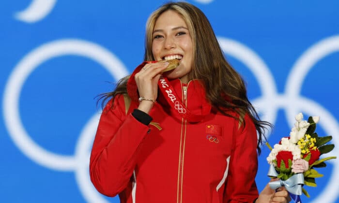2022 Beijing Olympics - Victory Ceremony - Freestyle Skiing - Women's Freeski Big Air - Beijing Medals Plaza, Beijing, China - February 8, 2022. Gold medallist Gu Ailing Eileen of China celebrates on the podium. REUTERS/Tyrone Siu