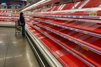A shopper picks over the few items remaining in the meat section, as people stock up on supplies amid coronavirus fears, at an Austin, Texas, grocery store on March 13, 2020. REUTERS/Brad Brooks