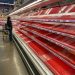 A shopper picks over the few items remaining in the meat section, as people stock up on supplies amid coronavirus fears, at an Austin, Texas, grocery store on March 13, 2020. REUTERS/Brad Brooks