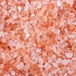 Pink himalayan salt background. Close up.