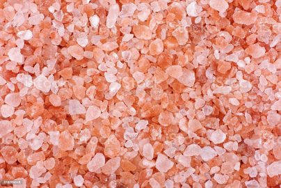 Pink himalayan salt background. Close up.