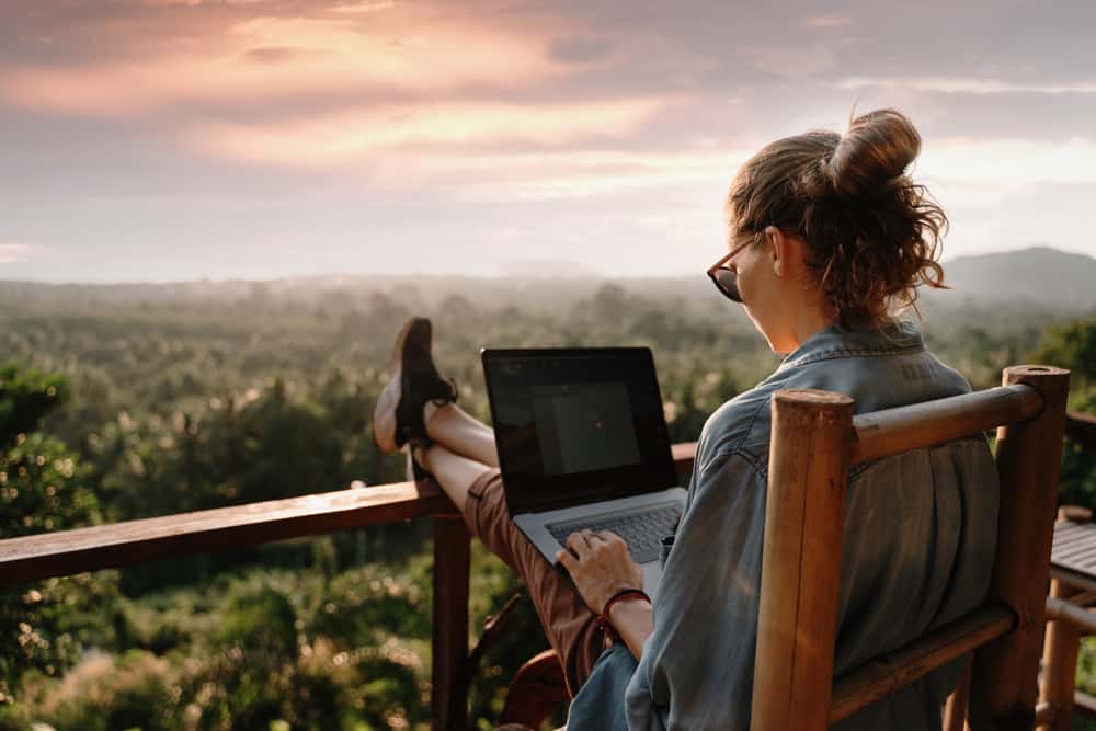 girl-remote-work-laptop-lifestyle-balcony-2022-truth