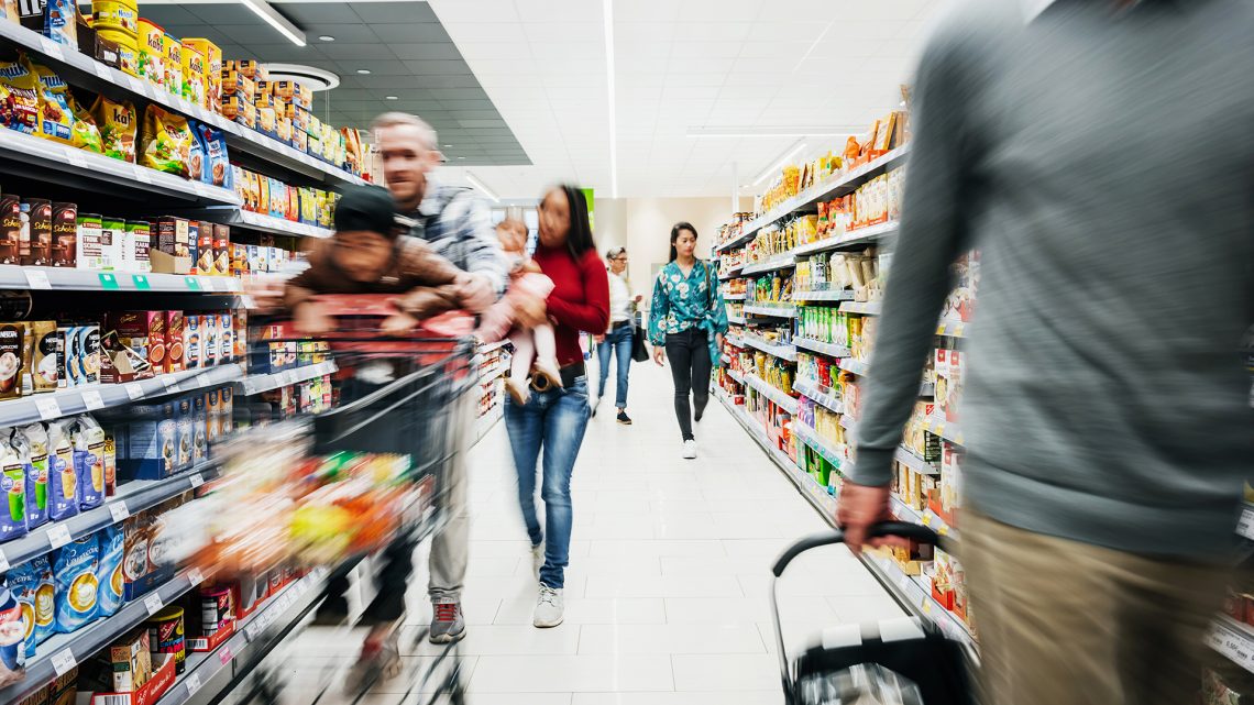 Busy Supermarket Aisle With Customers