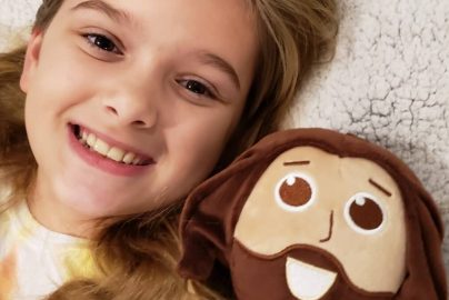 girl-talking-Jesus-doll-eternal-Christmas