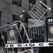 Barricades are unloaded from a truck near the courts in New York, Monday, March 20, 2023. (AP Photo/Seth Wenig)