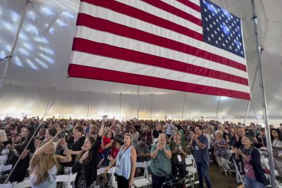 reawaken-america-tour-attendance-audience-large-usa-american-flag-apnews-com-2023-truth