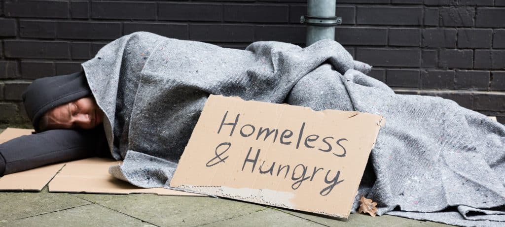 homelessness-sleeping-sign-davismcdonald-author-com-2024-truth