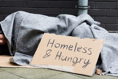 homelessness-sleeping-sign-davismcdonald-author-com-2024-truth