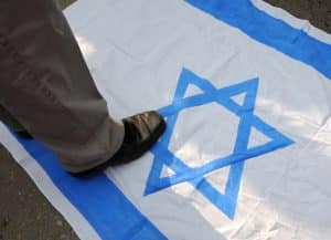 zionism-stepping-on-israel-flag-nytimes-com-2024-truth