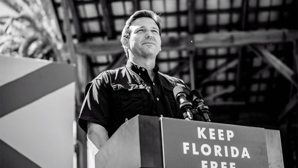 ron-desantis-bw-2-stage-podium-keep-florida-free-religionnews-com-2025-truth